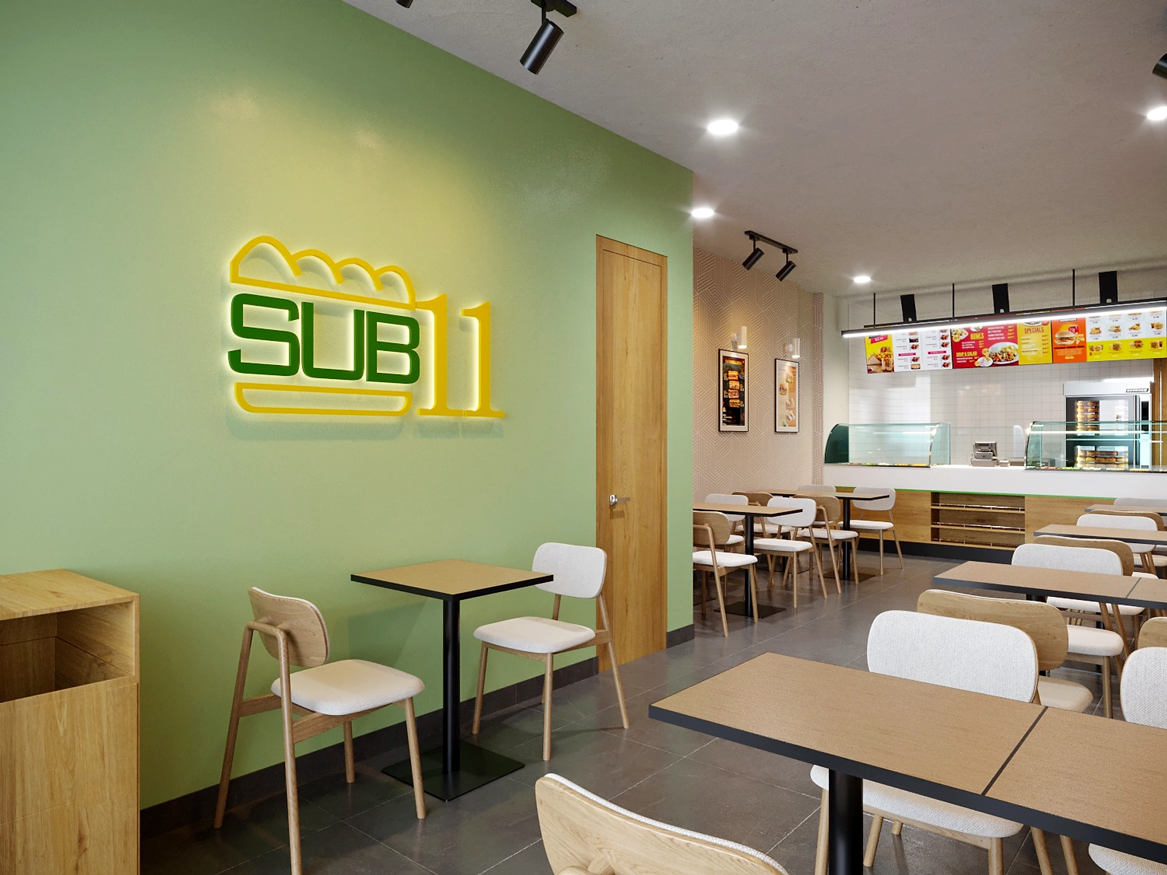 SUB11 store interior with the green logo wall